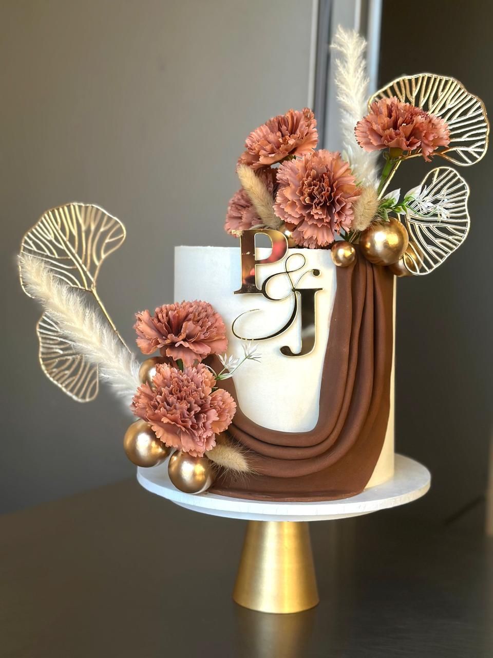 Terracotta Drape & Carnations — a custom cake by Sky Cakes